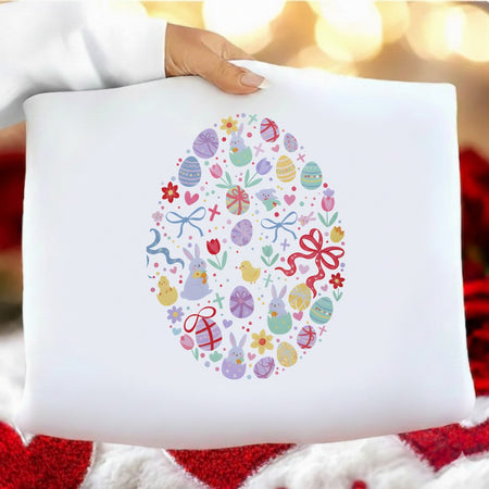 White pillow with Easter-themed design held by a person against a blurred background