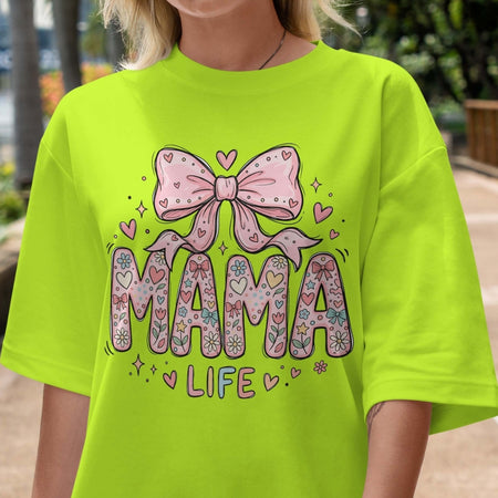 Person wearing a bright green t-shirt with 'MAMA LIFE' design featuring a pink bow.