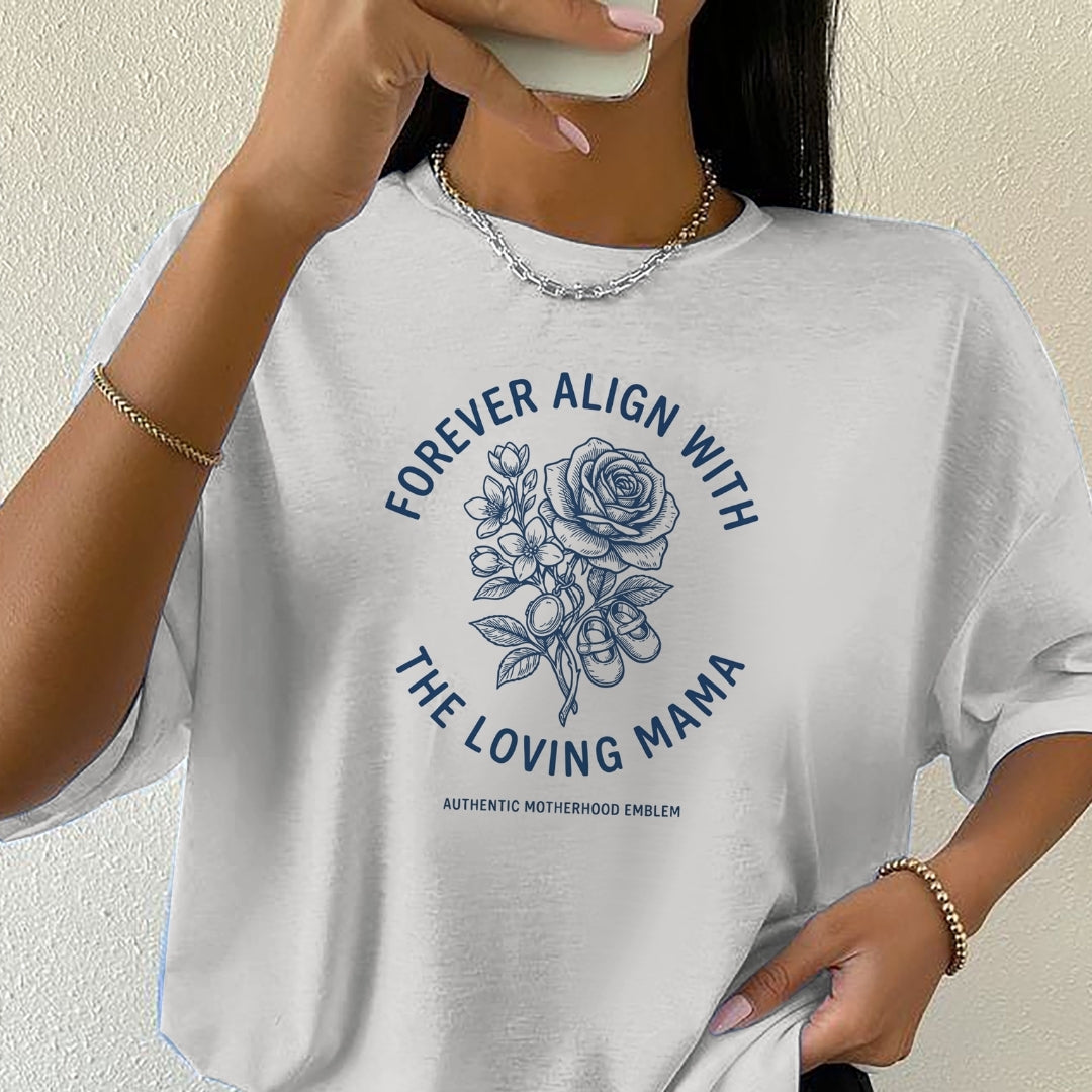 Person wearing a white t-shirt with a floral design and text.