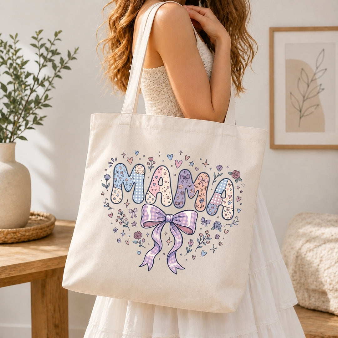 Person holding a tote bag with 'MAMA' design in a home setting