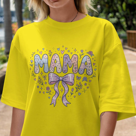 Person wearing a bright yellow t-shirt with 'MAMA' and decorative elements.