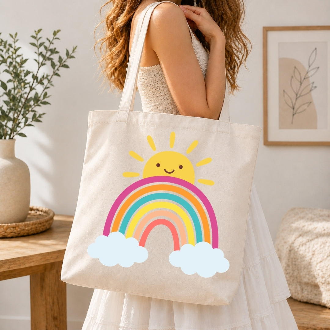 Person holding a tote bag with a sun and rainbow design in a home setting.