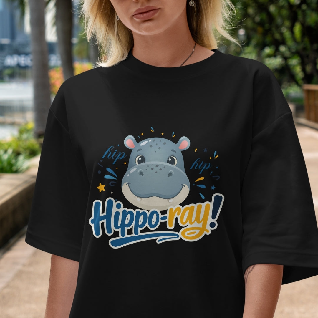 Person wearing a black t-shirt with a hippo graphic and text in an outdoor setting