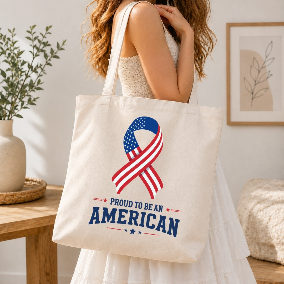 Tote bag with American flag ribbon design held by a person in a home setting