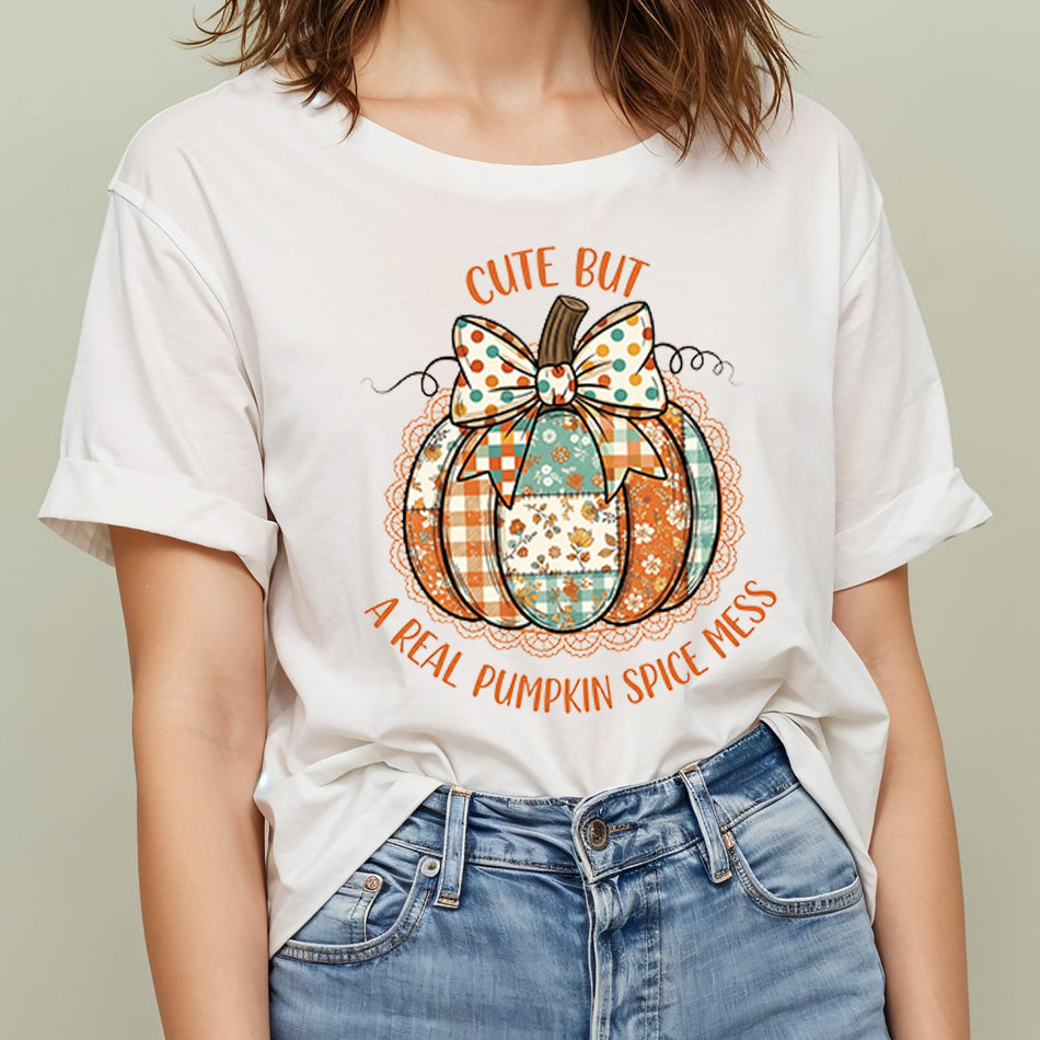 Person wearing a white t-shirt with a pumpkin graphic and text.