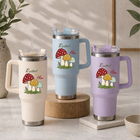 Three insulated travel mugs with mushroom design on a neutral background