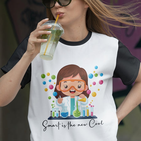 Person wearing a t-shirt with a cartoon character and text, holding a drink.