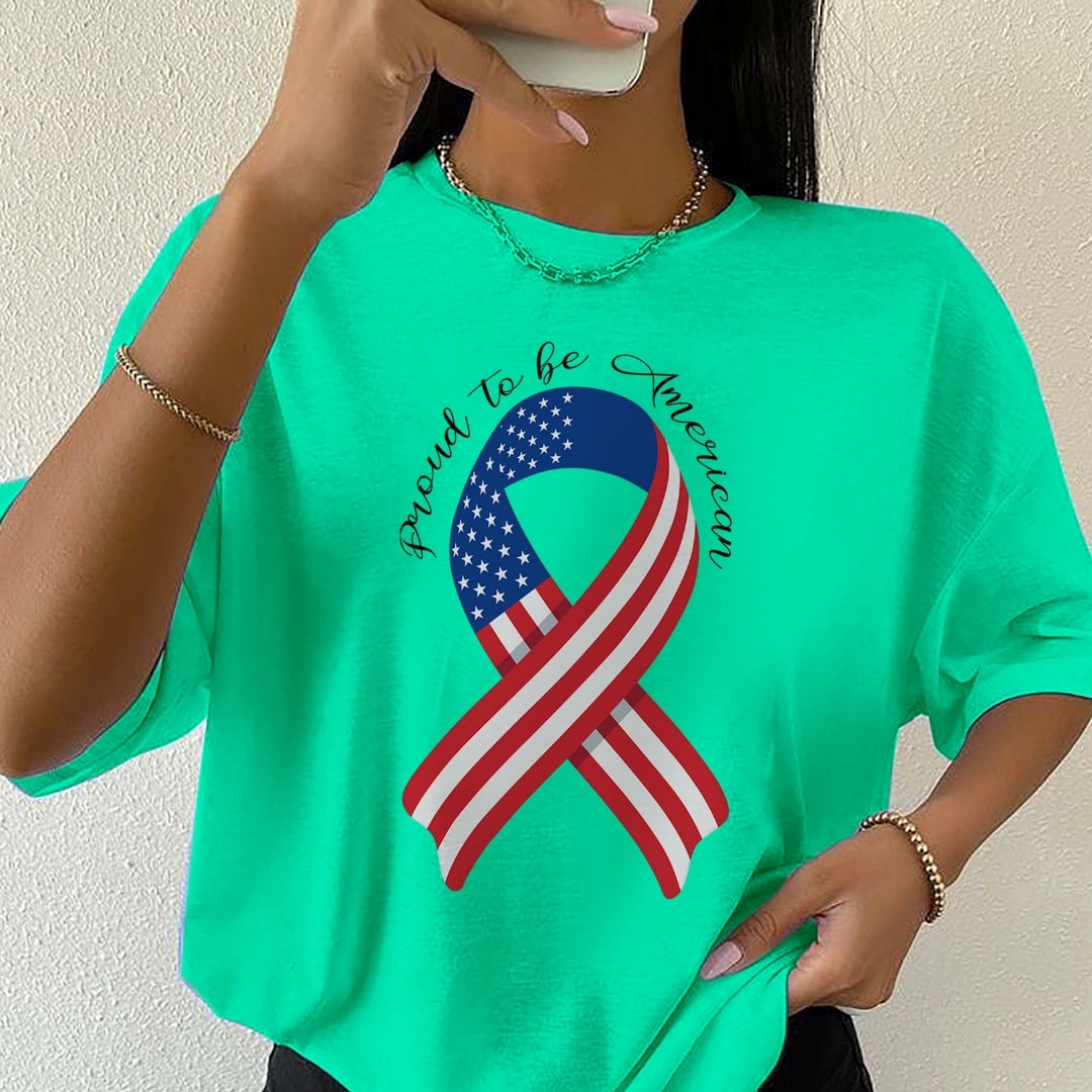 Person wearing a green t-shirt with an American flag ribbon design and text.